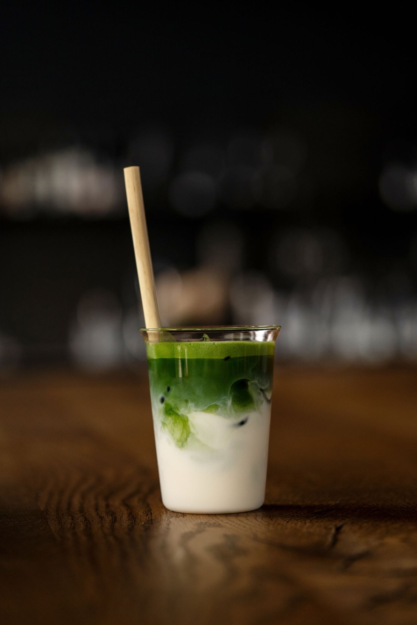 Iced matcha in glassware with a natural bamboo straw, an application reference.