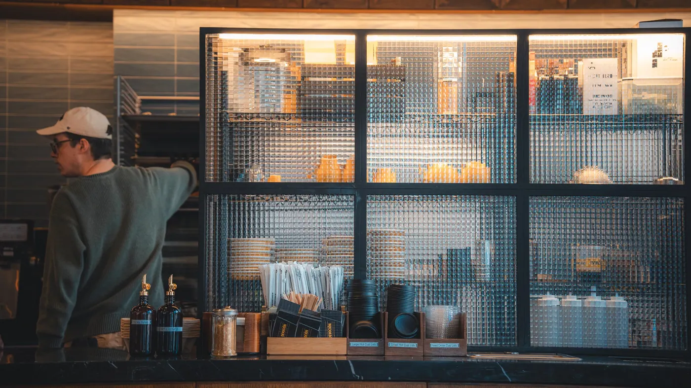 A barista at a café counter